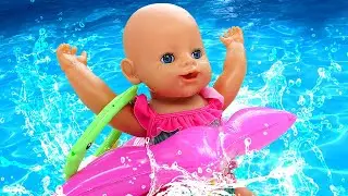 Baby Born doll plays in a ball pit & toy slide. Pretend play with toys. Baby dolls videos for kids.