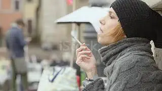 Young Woman Relaxing Smoking A Cigarette Sitting On The Sidewalk Stock Video   Download Video Clip N