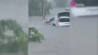 St. Louis County police officers rescue driver from flooded car