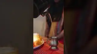 Pouring hot tea in the Cup