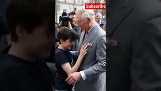 Playful moment of King Charles Dancing with Kids