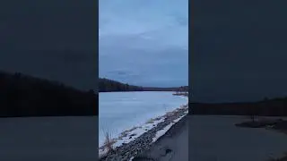 Gorgeous Blue Skies Hanging Over White Icy Lake with Sun Setting