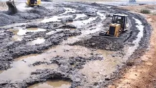 Harvey Equipment Repairing Road With Gravel. excavator, Dozer, Motor Grader and Roller