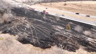 Drone video shows crews on scene of central Iowa grass fire