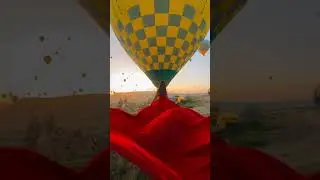 Watch how this stunning flying dress dances with the wind against a backdrop of Balloons. 👗🎈
