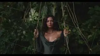Sensual Woman in Green Swimsuit Posing in Lush Jungle Setting