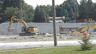 filling the dump trucks with concrete from I96 in Inkster area