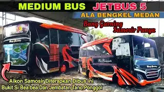 MEDIUM BUS JETBUS 5,ALA BENGKEL MEDAN,DENGAN CIRI KHAS GAMBAR AIKON SAMOSIR PADA BAGIAN BELAKANG BUS