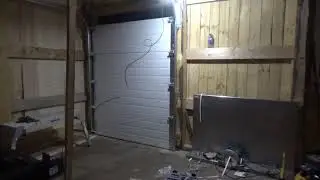 Darrell and Joe build a Maple sugar shack - roll up door install started