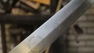 Heat treating and electric etching a sword.