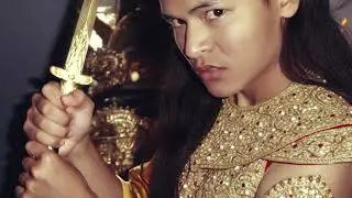 Angkor warrior holding on a sword stance.