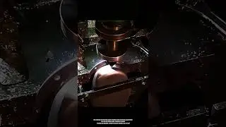 Precision contour milling process shaping curved metal surface on CNC workstation
