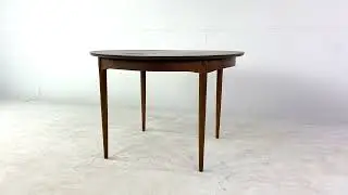 Mainline by Hooker Mid Century Round Walnut Expanding Dining Table with 2 Leaves