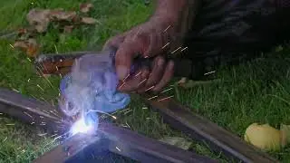stick welding on grass closeup