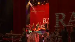 RAYE singing 