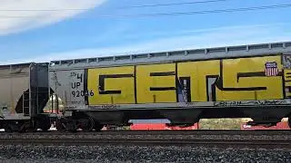 Friendly crew on southbound Union Pacific manifest passing Canyon in Cajon Pass. Leader UP 7136.