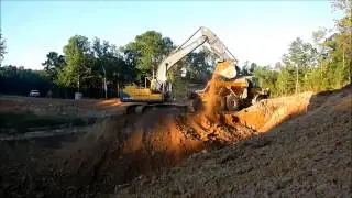 Volvo 210BL Excavator Loading Dirt