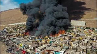 NoComment | Un incendio descontrolado calcina cien casas de un barrio pobre de Iquique en Chile