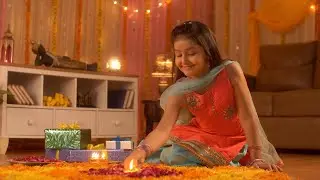 Diwali festival decoration - A cute happy girl decorating rang... | Indian Stock Footage | Knot9