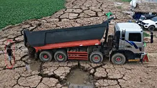 Incredible!! Working Technology LandFilling Strong 25ton Dump Truck pouring Soil Stone Into Water.