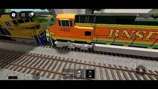 BNSF or CNSF or something 4521 Chase's the train in front