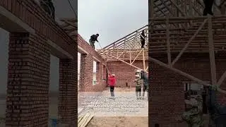 Farmers Hoisting Handcrafted Wooden Beams with Rope Systems for Roof Construction
