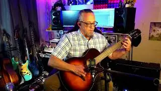 Yamaha NTX1 hybrid classical guitar. It's fantastic IMO! Mic with Boss Katana bringin' the 'verb