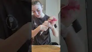 Demonstrating how to make and decorate a cake at Great American Cookie.