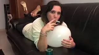 Woman smokes with a balloon