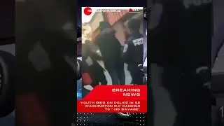 DO YOU THINK THIS POLICE WANTS TO BUSS OUT AND DANCE WITH THESE KIDS ?