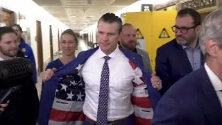 Pete Hegseth shows off American flag lined suit jacket at Capitol Hill