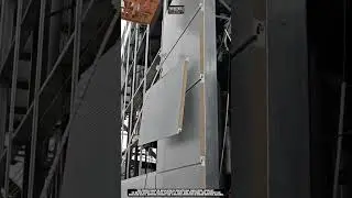 Installing insulated wall panel using boom lift tool