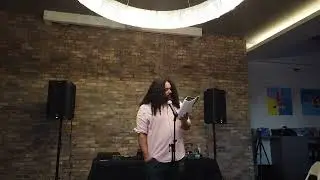 Travis White recites poetry at the Poetry.Hype Open-Mic by Poetry Hype