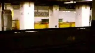 Redbird train of R33WF and R33ML passing through Grand Central