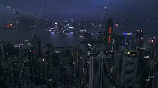 Stunning aerial view of Victoria Harbor and Hong Kong on the shore of it during the night