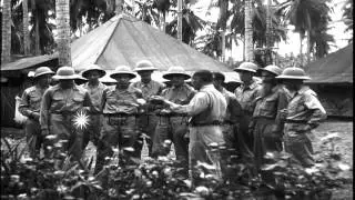 Officer talks to crew members at Henderson Field in Guadalcanal Island in Pacific...HD Stock Footage