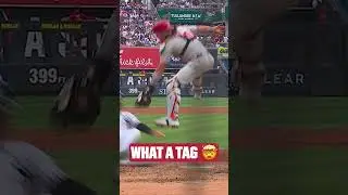J.T. Realmuto applies the mid-air tag at home! 🤯