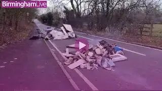 Fire crew extinguish burning rubbish dangerously dumped in middle of busy West Midlands lane