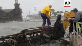 Slow-moving Tropical Storm Debby's outer bands lashed Florida with rain and kicked up rough surf off