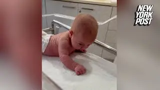 Newborn baby lifts her head and crawls at just 3 days old