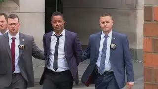 Actor Cuba Gooding Jr. led by police in handcuffs