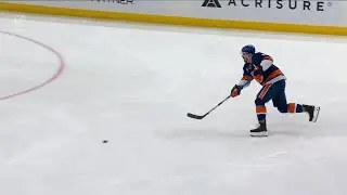 Mathew Barzal scores a goal against the New Jersey Devils