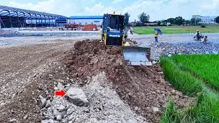 Great and powerful bulldozer with excellent skill operator push soil filling land with dump trucks 
