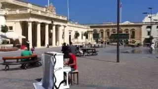 Street music on a piano in Malta
