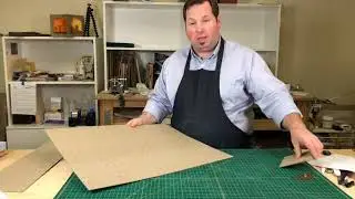Finding the grain of paper and board for bookbinding