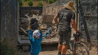 Start them young! Junk removal help loading a 40 yard dumpster