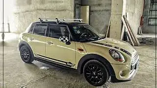 The BMW MINI is installed with a NEUMANN 305s roof rack.