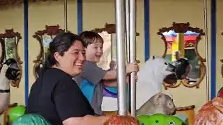 Houston Zoo. Atlas riding the carousel for the first time.
