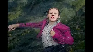 beautiful secretary after work cool poses in wet clothes on the beach by the sea for wetlook video