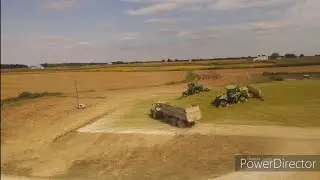 Chopping corn silage with a Class 980,and pushing feed with 2 John deere 9620RX